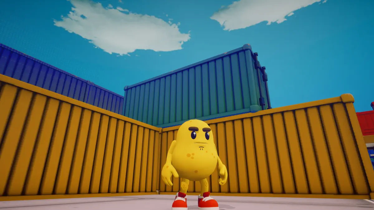 The potato character stands in a yard of yellow and blue containers